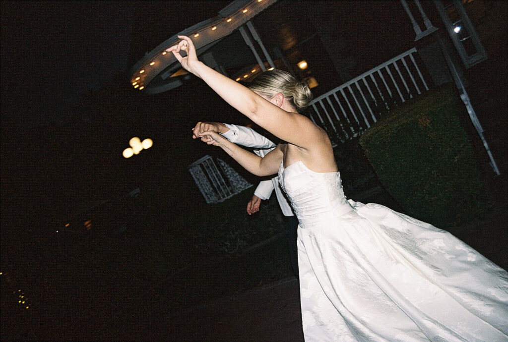 bride and groom walking to dance floor for their first dance