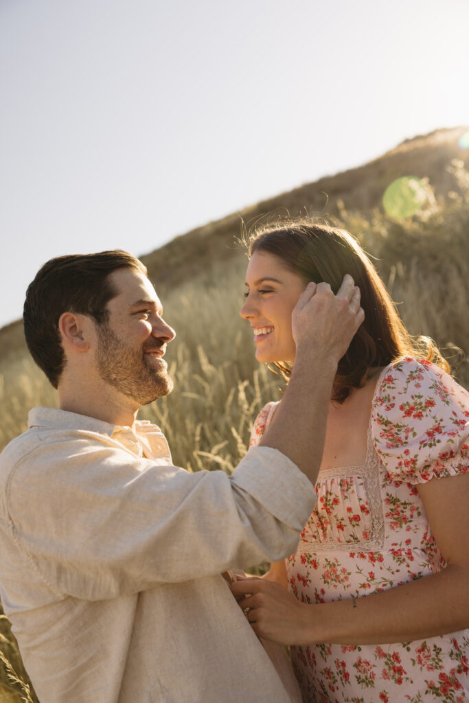 couple standing in open field in fort collins during their colorado engagement