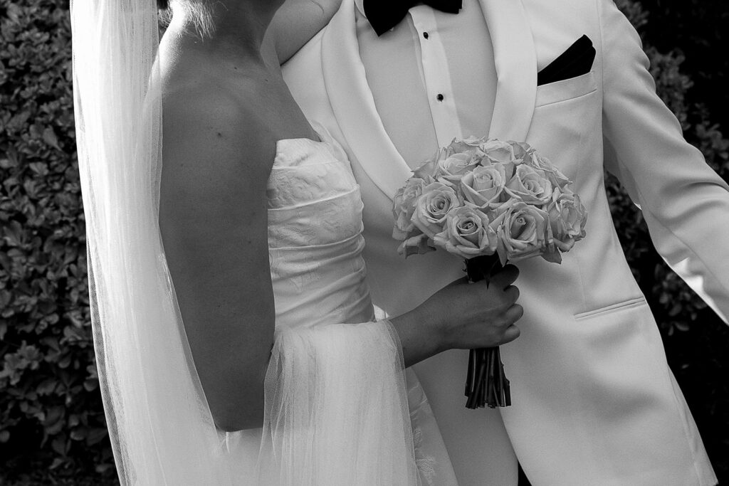 bride and groom standing with each other during portraits