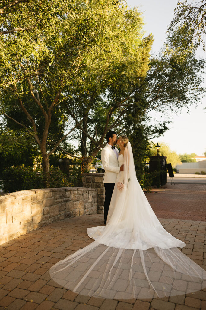 A luxe timeless wedding day in Scottsdale Arizona with bride and groom kissing