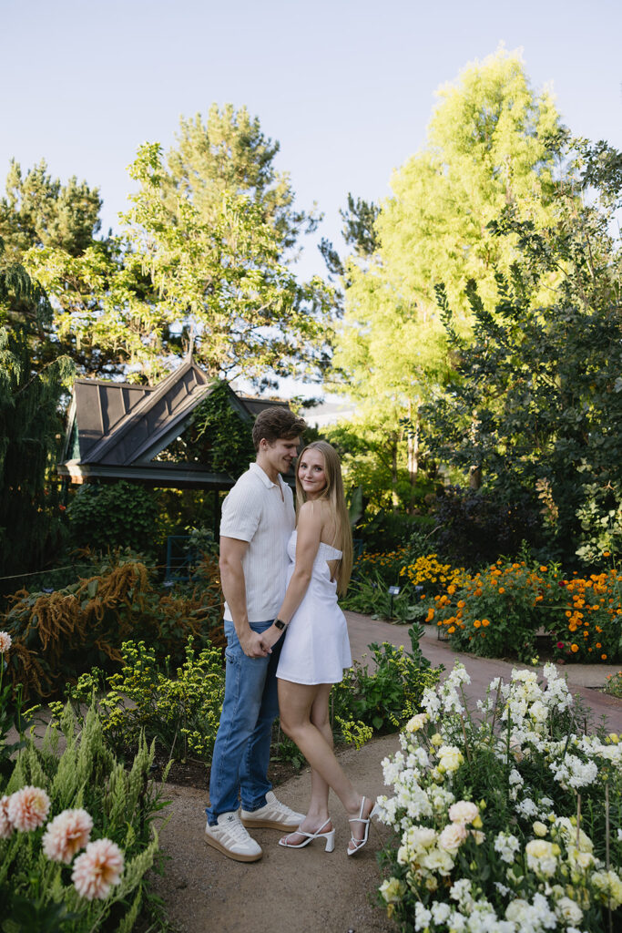 couple standing in front of the garden  at denver botanical gardens 