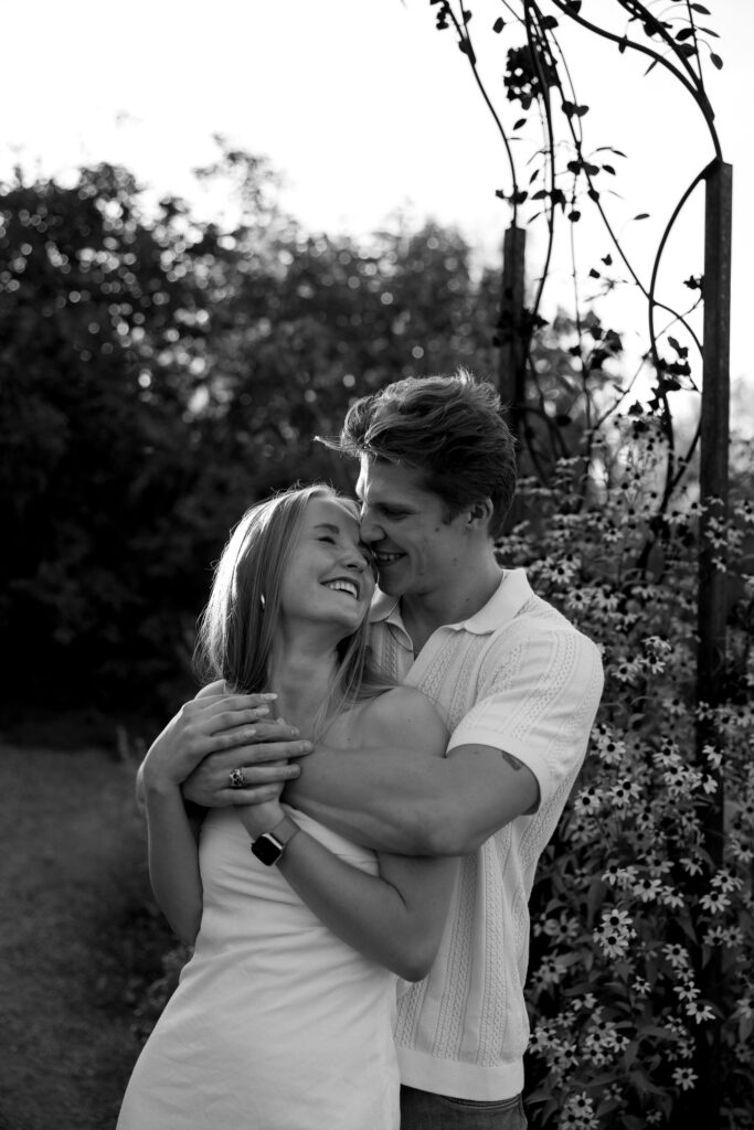 couple standing in front of the garden  at denver botanical gardens 