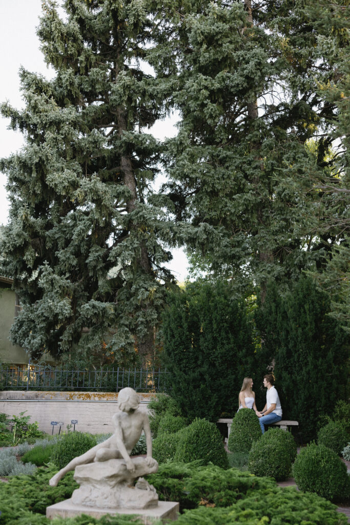 couple standing in front of the garden  at denver botanical gardens 