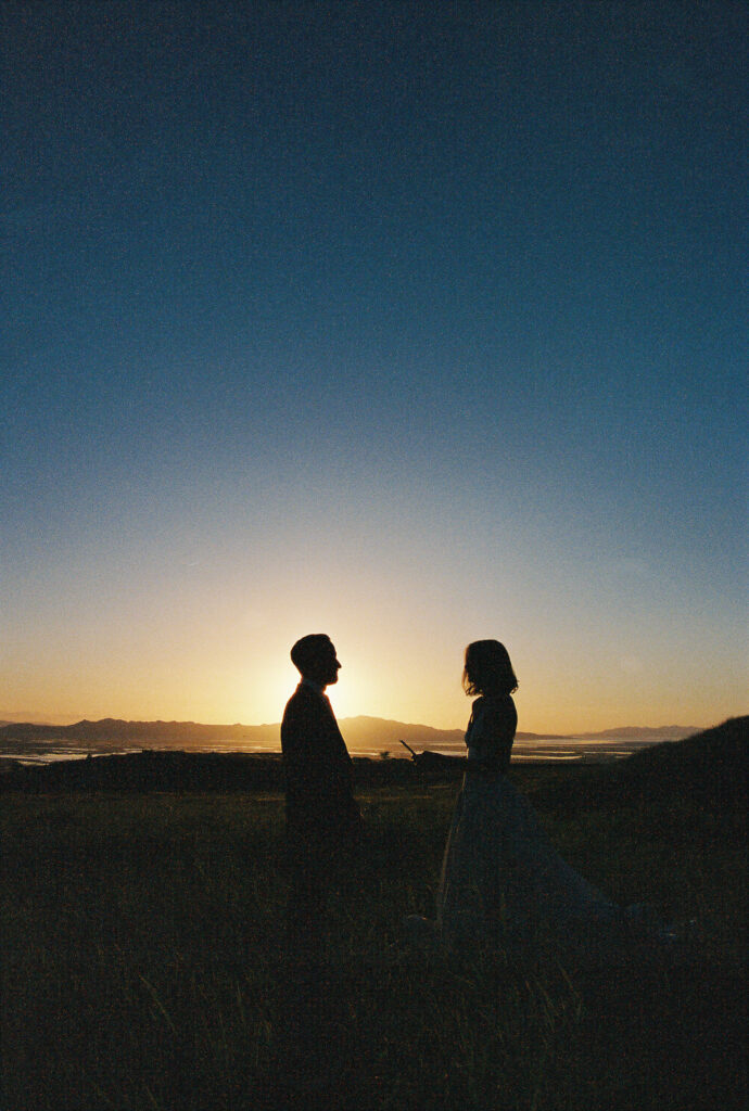 bride and groom holding hands during sunset photos captured on film photography