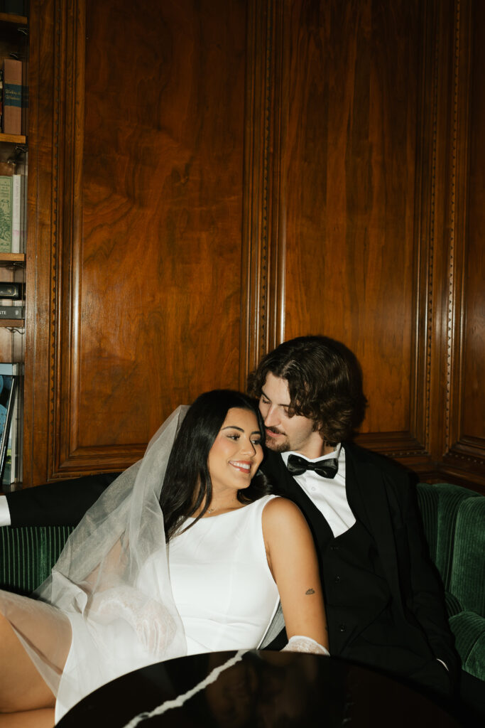 bride and groom at reception sharing a drink in a bar