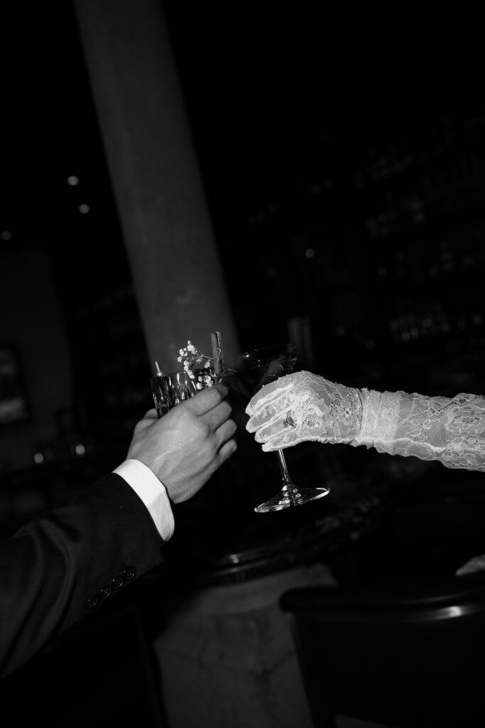 bride and groom celebrating with a cheers after their wedding day