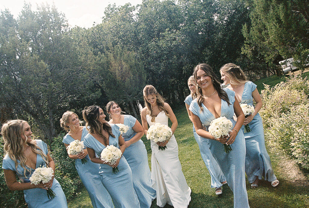 bride walking with bridesmaids captured on film photography