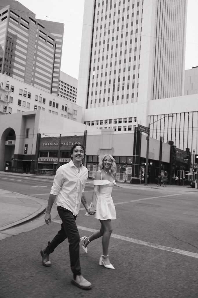 couple holding hands walking during couples session