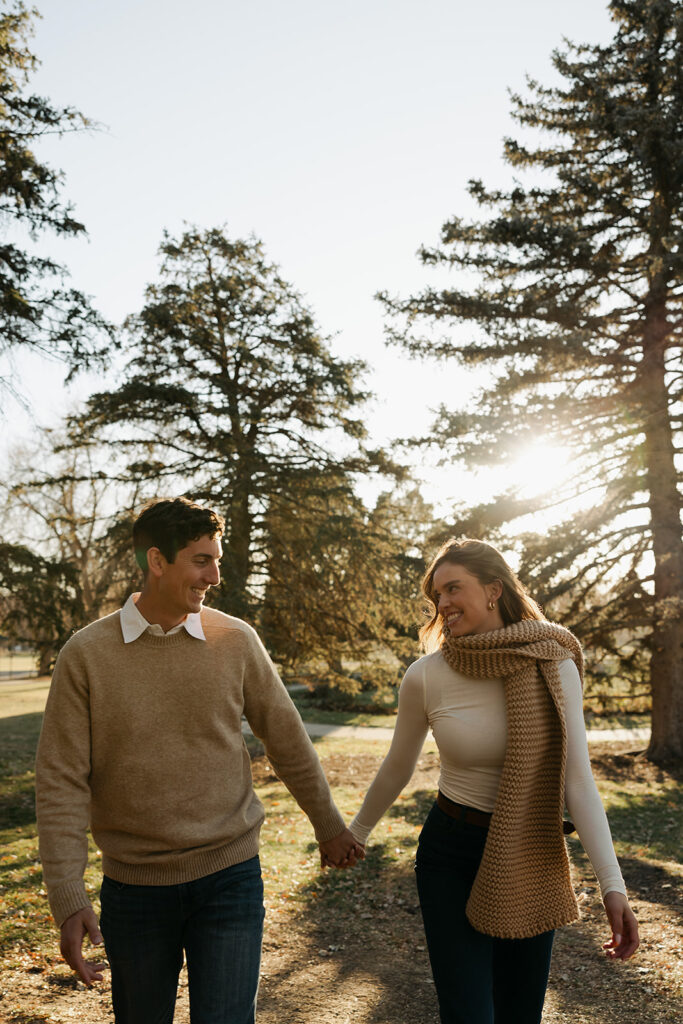 couple walking with each other during colorado engagement photos