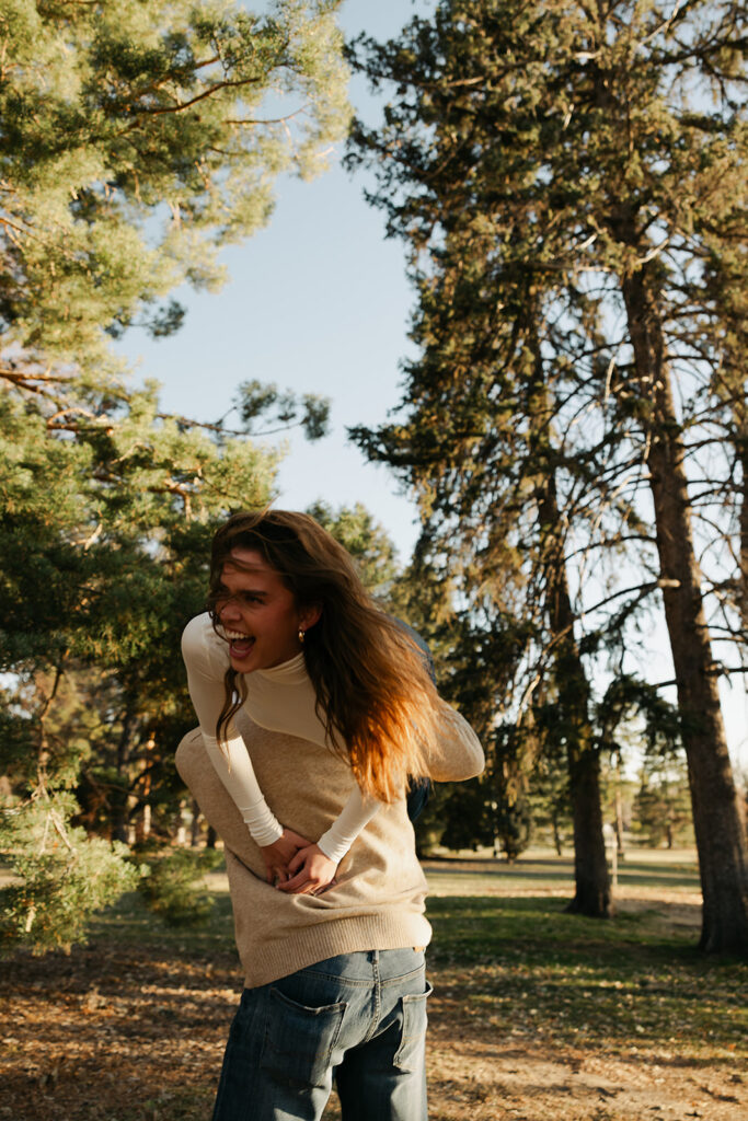 couple dancing at cheesman park in denver during their colorado engagement photos