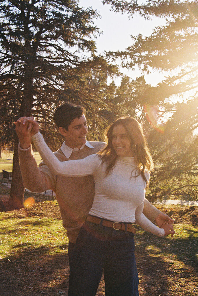 film photo of couple dancing in a park during couples session