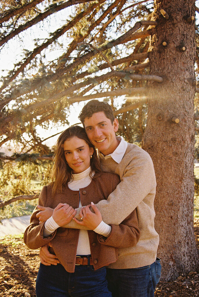 film photo of couple holding each other at park during couples session