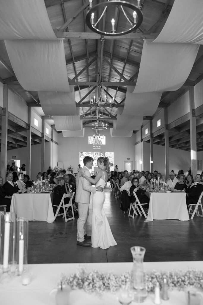 black and white photo of bride and grooms first dance