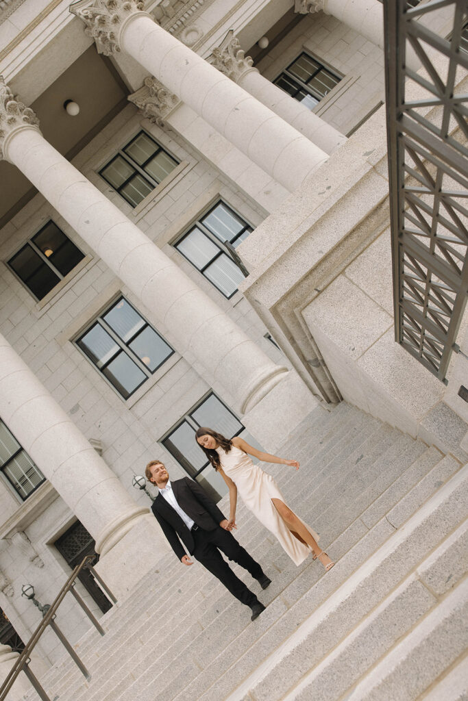 cute couple walking around their dream engagement location