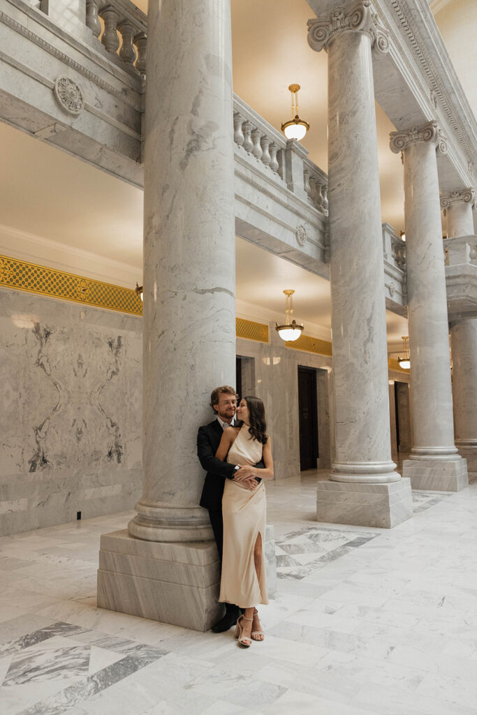 newly engaged couple kissing during their photoshoot 