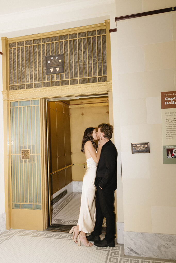 picture of the newly engaged couple kissing