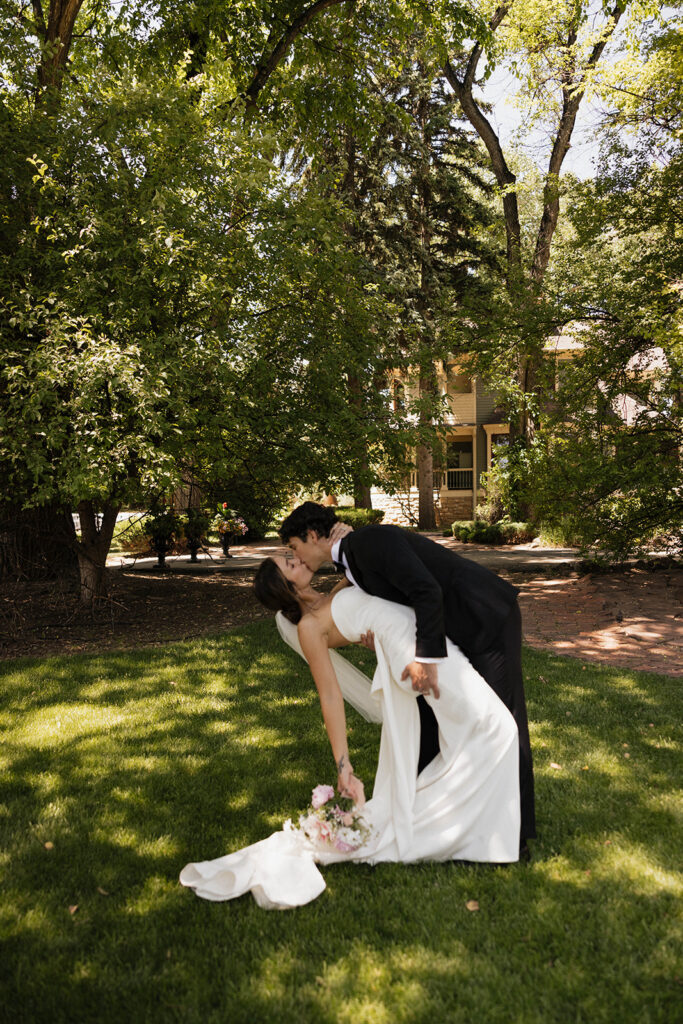 portrait of the newlyweds kissing
