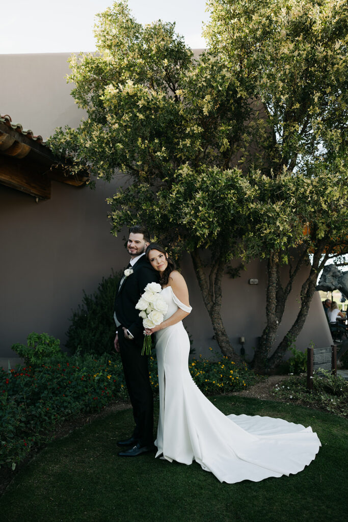 portrait of the bride and groom posing for the camera during their bridal portraits 