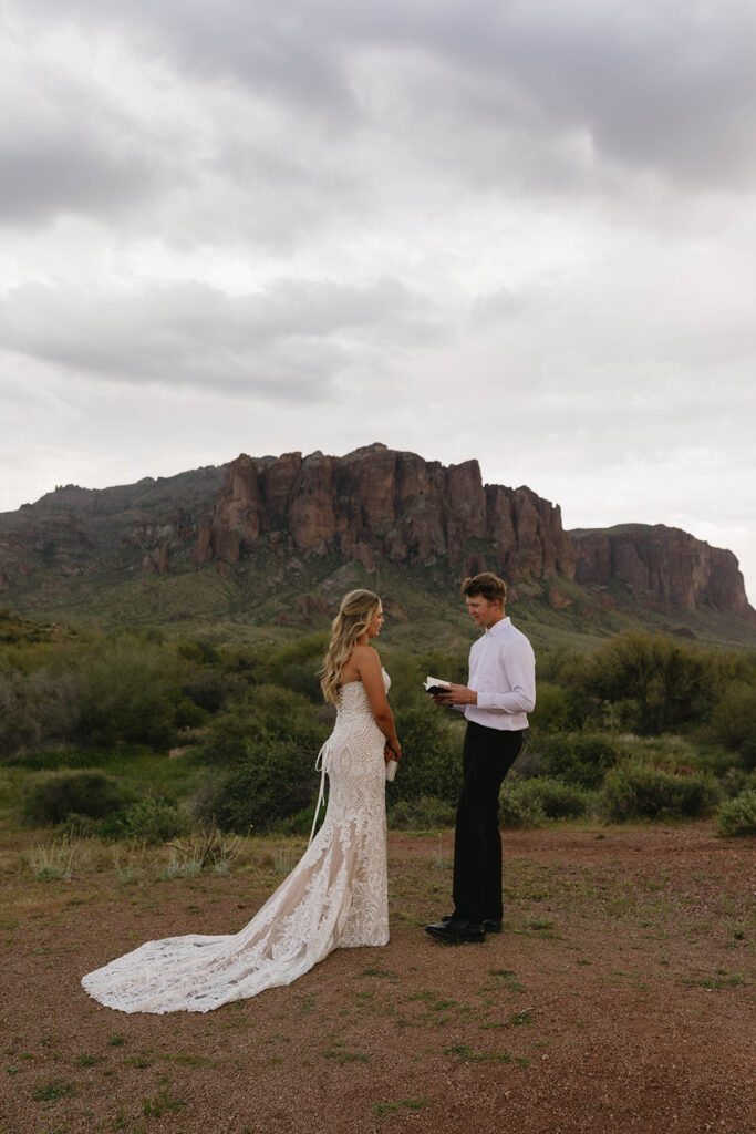 cute picture of the bride and groom reading their vows 