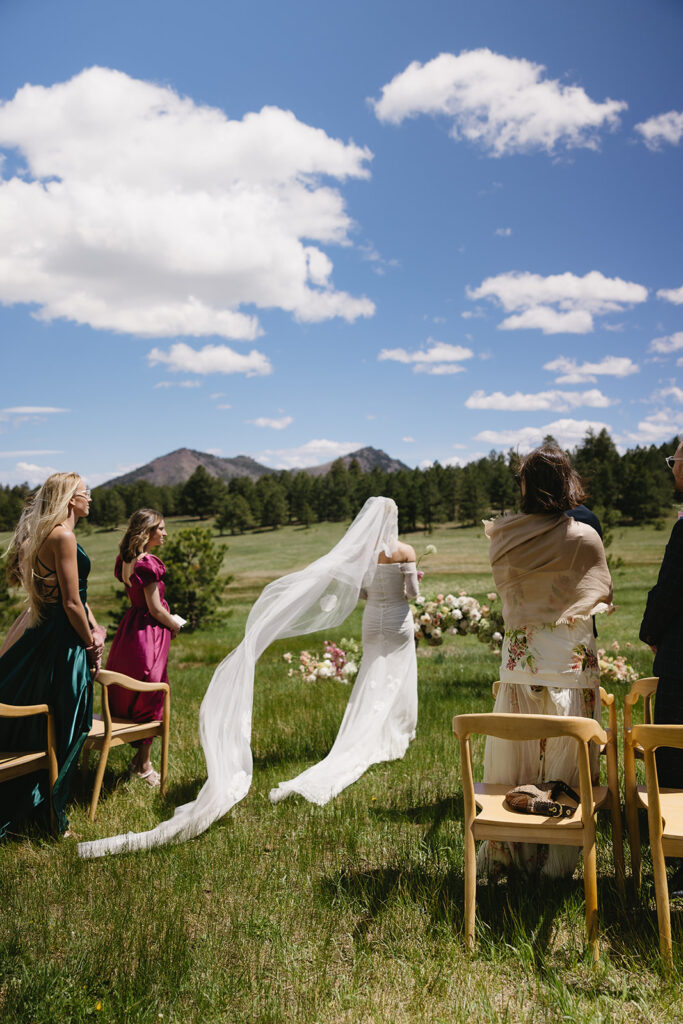 film inspired outdoor ceremony photos against a mountain backdrop at greystone castle boulder