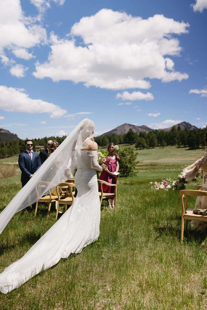 film inspired outdoor ceremony photos against a mountain backdrop at greystone castle boulder