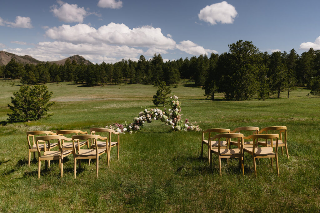 mountain wedding ceremony setup in colorado at greystone castle boulder