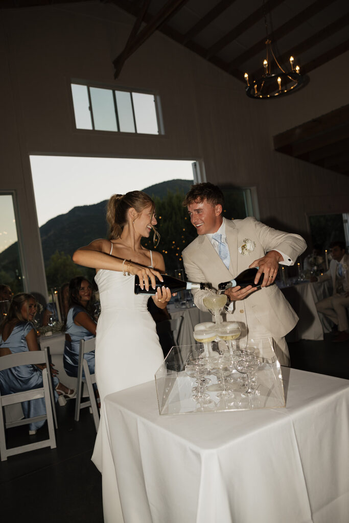 candid bride and groom photos of champagne tower