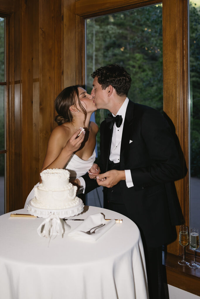 bride and groom cutting their wedding cake