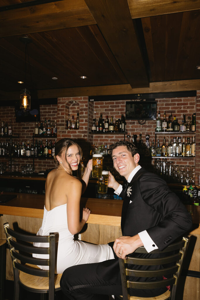 candid bride and groom photos drinking beer