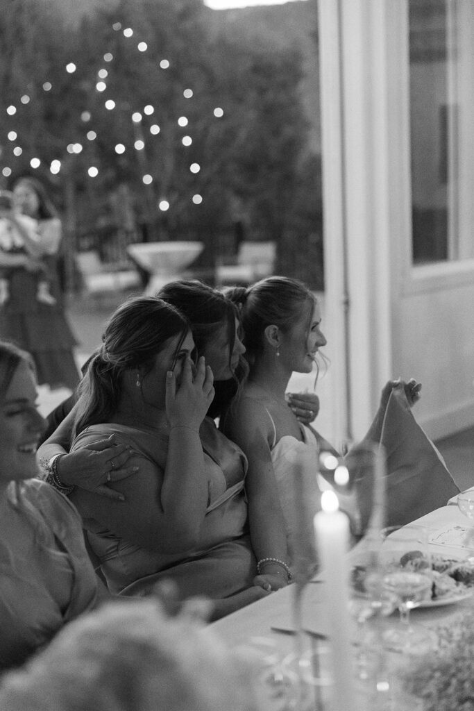 bridal party watching groom dance with mom