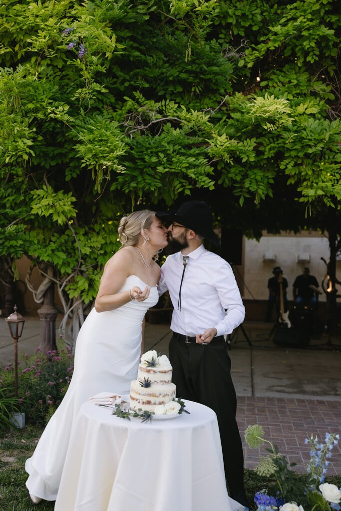 bride and groom eating their wedding cake
