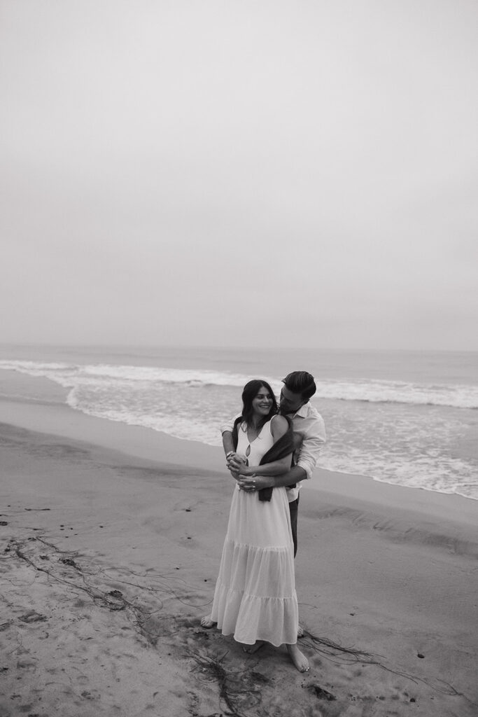 couple walking on the beach together in encinitas california
