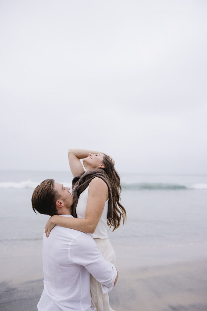 candid and cinematic couples photoshoot on a beach in san diego