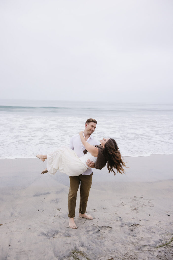 candid and cinematic couples photoshoot on a beach in san diego