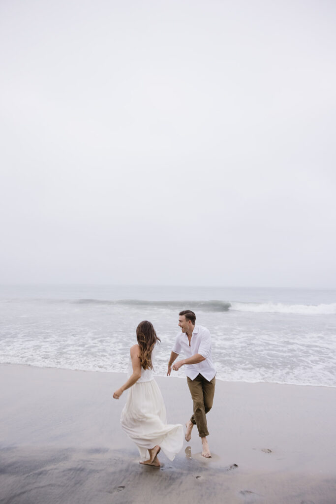 couple running on the beach