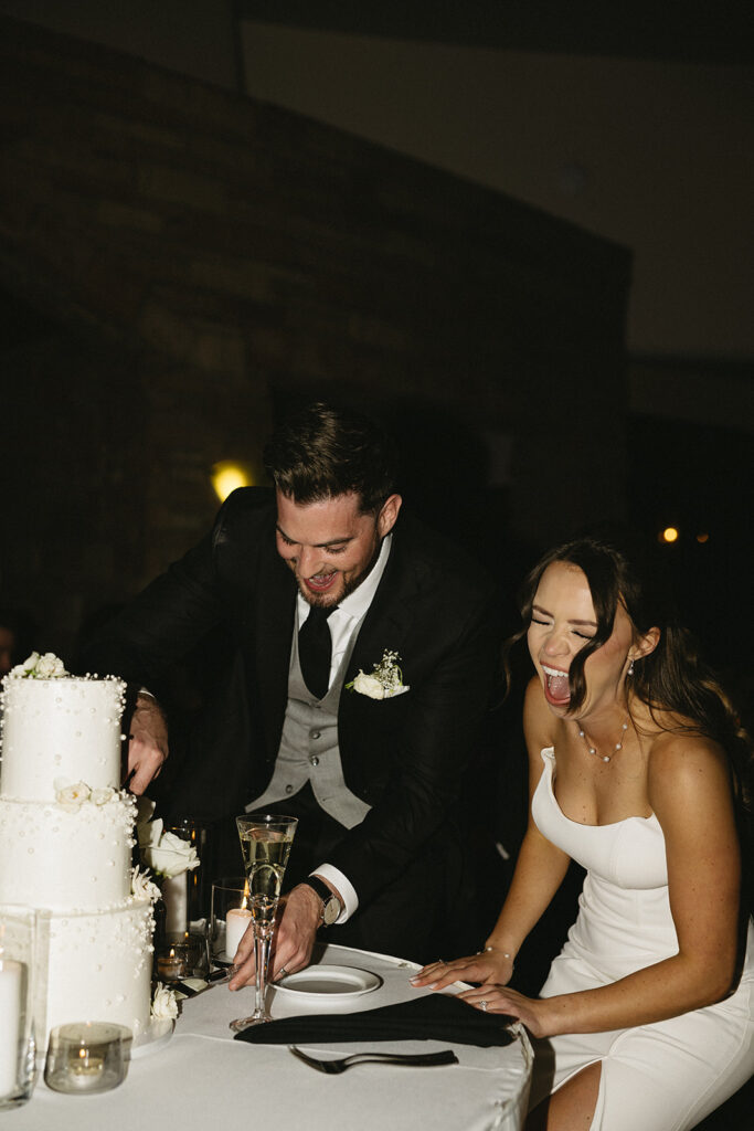 timeless bride and groom cutting the wedding cake photos during reception