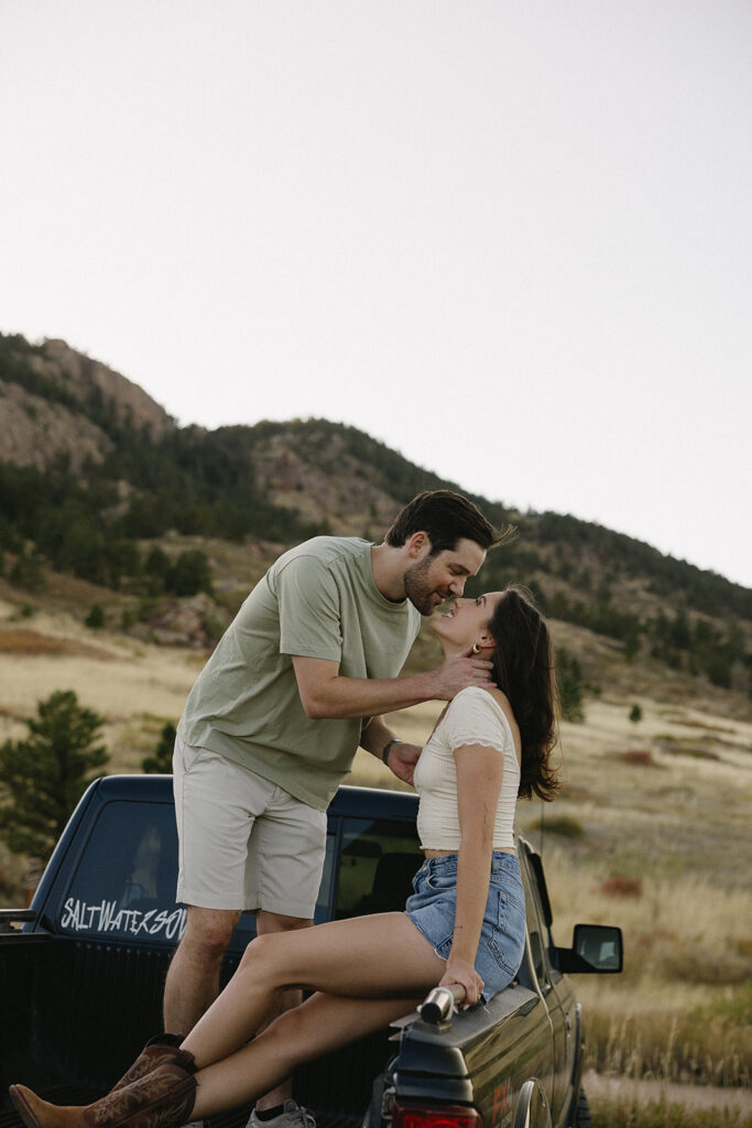 romantic couple poses in the mountains in colorado