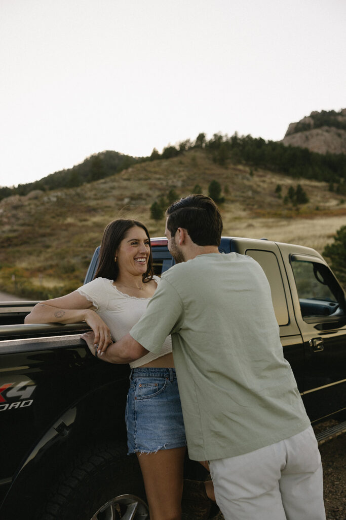 romantic couple poses in the mountains in colorado