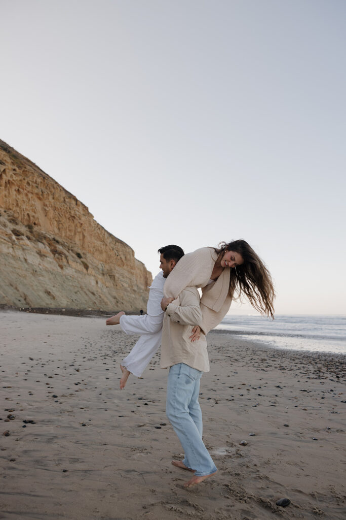 documentary style engagement photos beach engagement photos in san diego