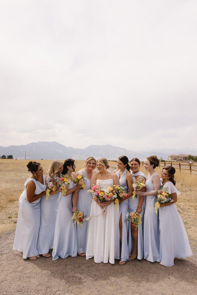 outdoor wedding bridal party photos at a colorado wedding venue in front of the mountains