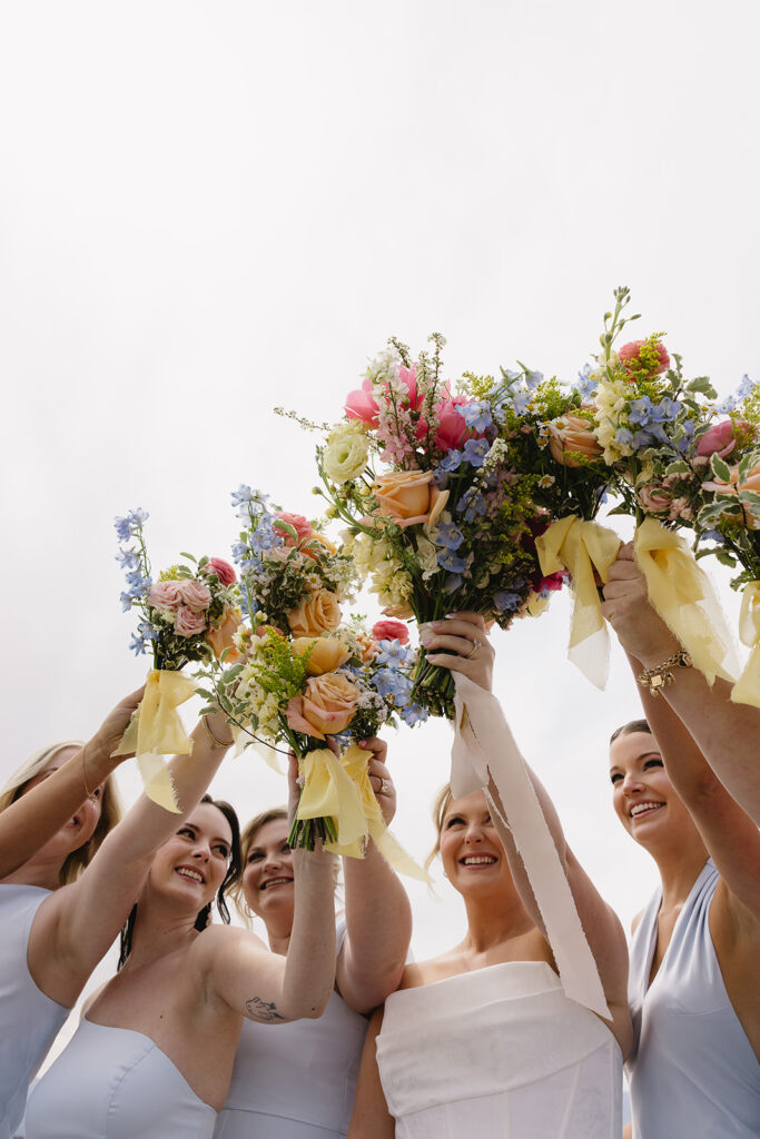 outdoor wedding bridal party photos at a colorado wedding venue in front of the mountains