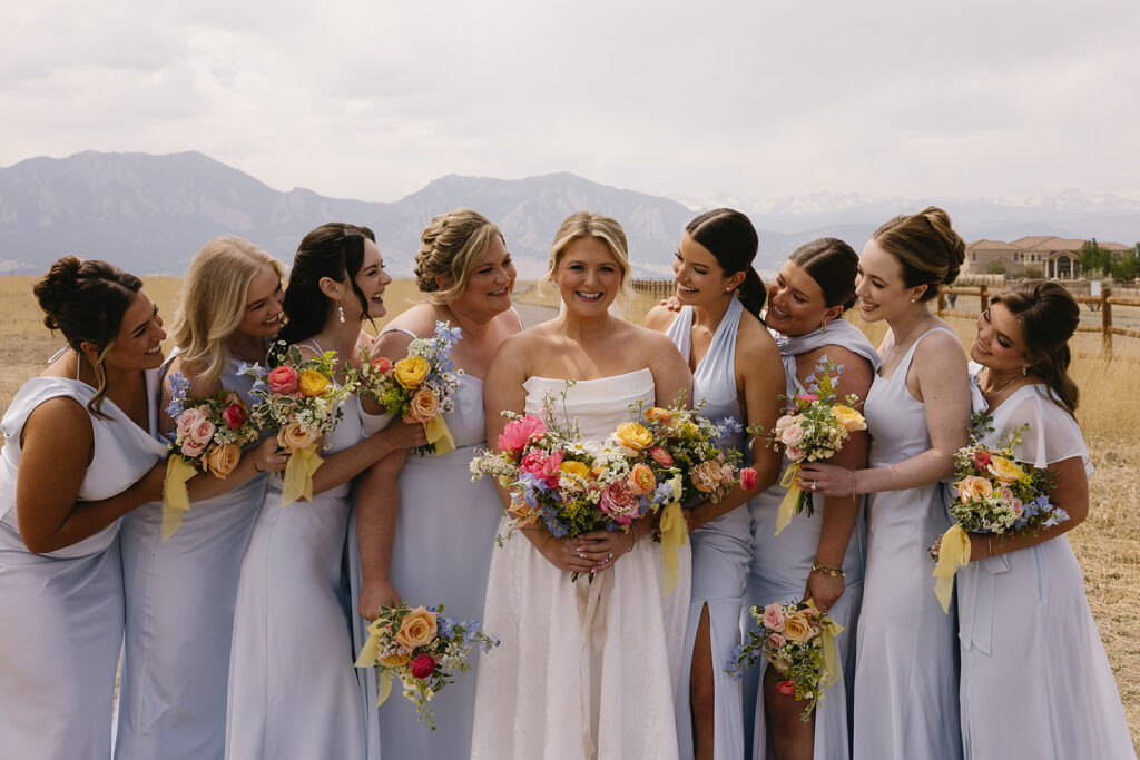 outdoor wedding bridal party photos at a colorado wedding venue in front of the mountains