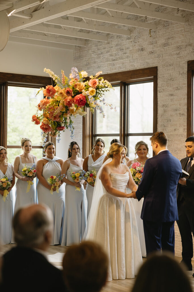 romantic wedding photos for an indoor ceremony bursting with color and intimate moments