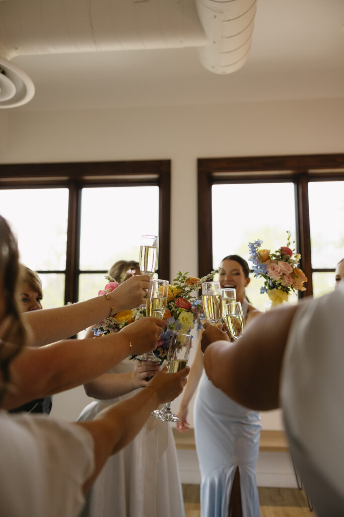 first look with bridesmaids in getting ready suite