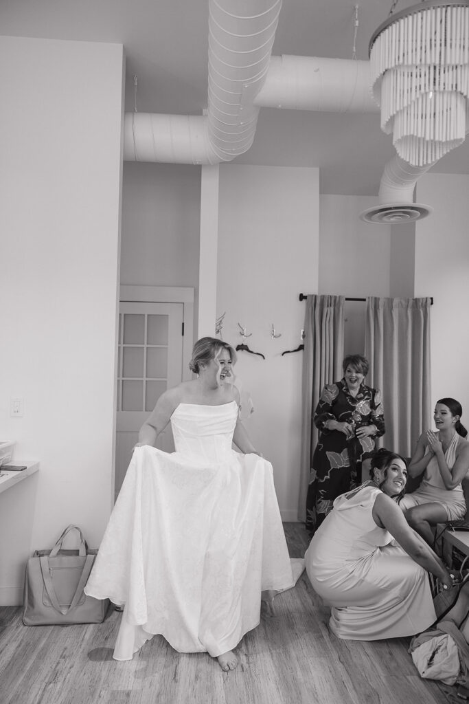 first look with bridesmaids in getting ready suite