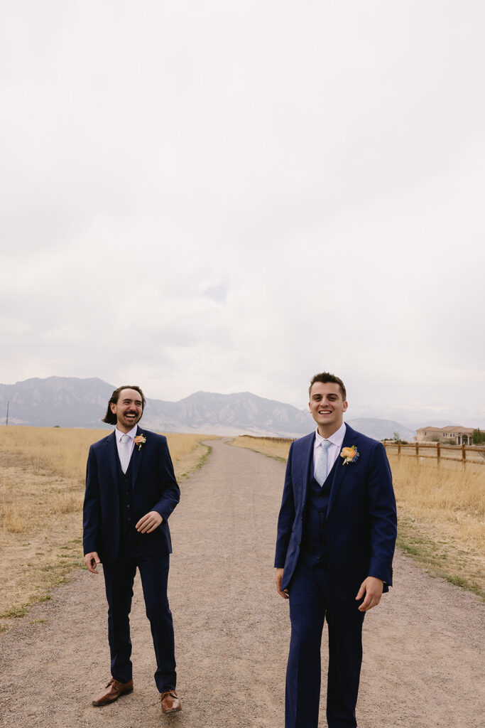 unique groomsmen poses candid groomsmen photos in the mountains for a spring wedding