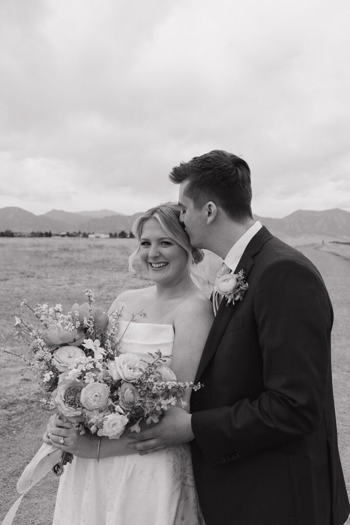 bride and groom photos in the mountains at a colorado wedding venue in the spring