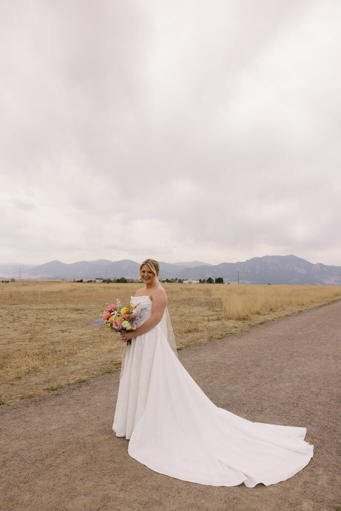 bridal portraits in the colorado mountains with a spring wedding flowers colorful and pastel colors