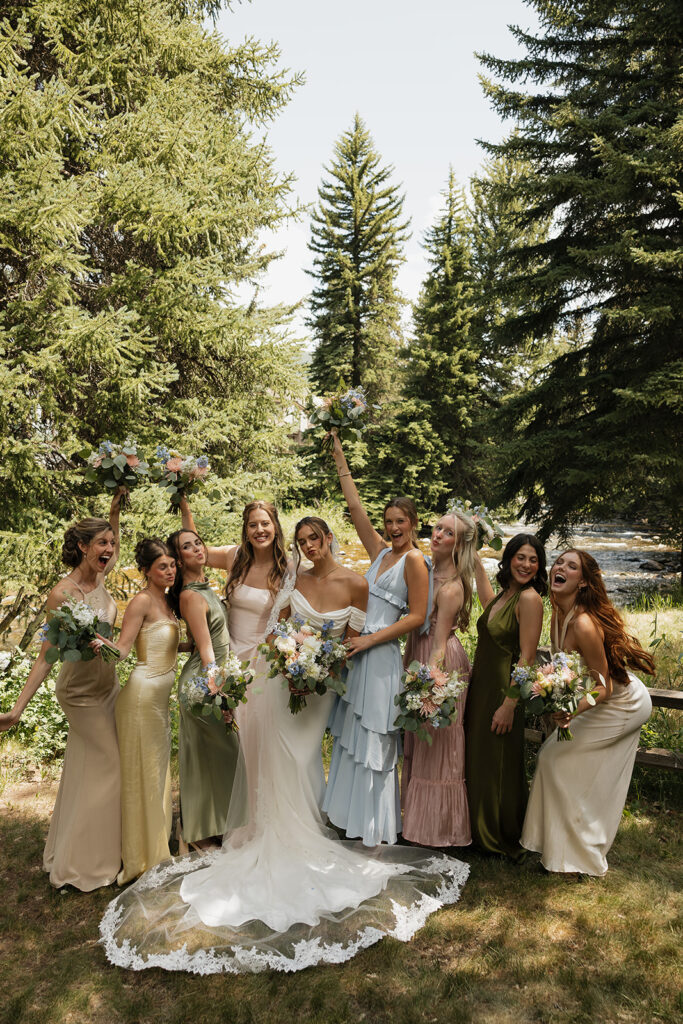 pastel spring bridesmaid dresses candid bridal party photo
