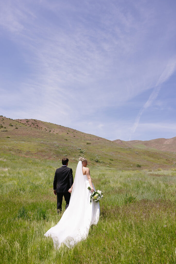 romantic wedding photos of the bride and groom with a mountain backdrop in boise idaho